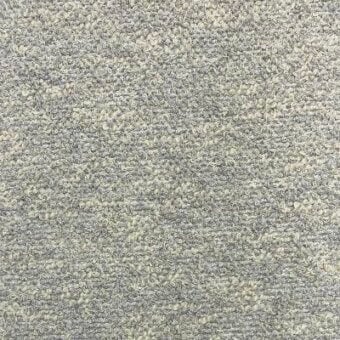Moroso bouclé fabric L1765.907 ash displays a dense, nubby texture with gray and cream tufts, exhibiting a looped construction and matte finish.